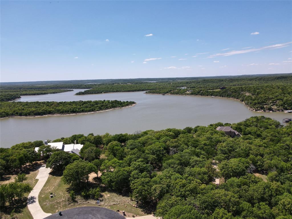 Tbd Ridgeline Drive Chico, TX 76431 - Photo 3 of 14 an aerial view of a houses with outdoor space and lake view