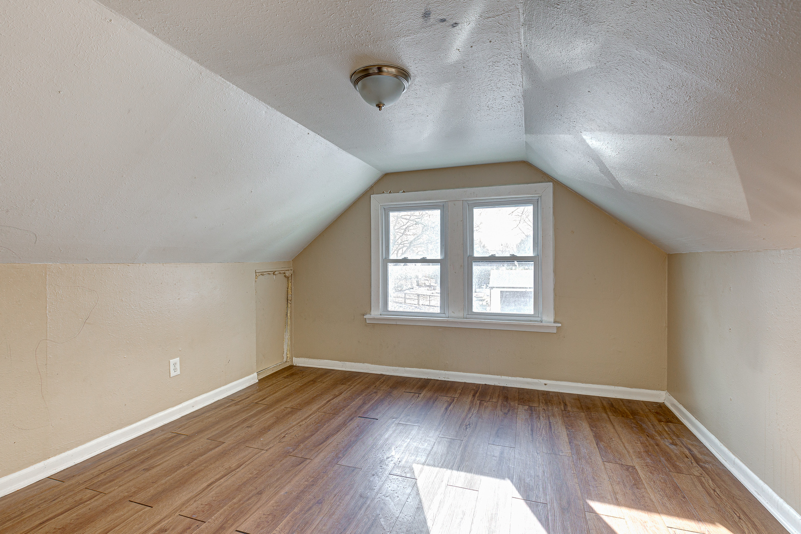 326 West Park Road Round Lake, IL 60073 - Photo 12 of 22 an empty room with wooden floor and windows