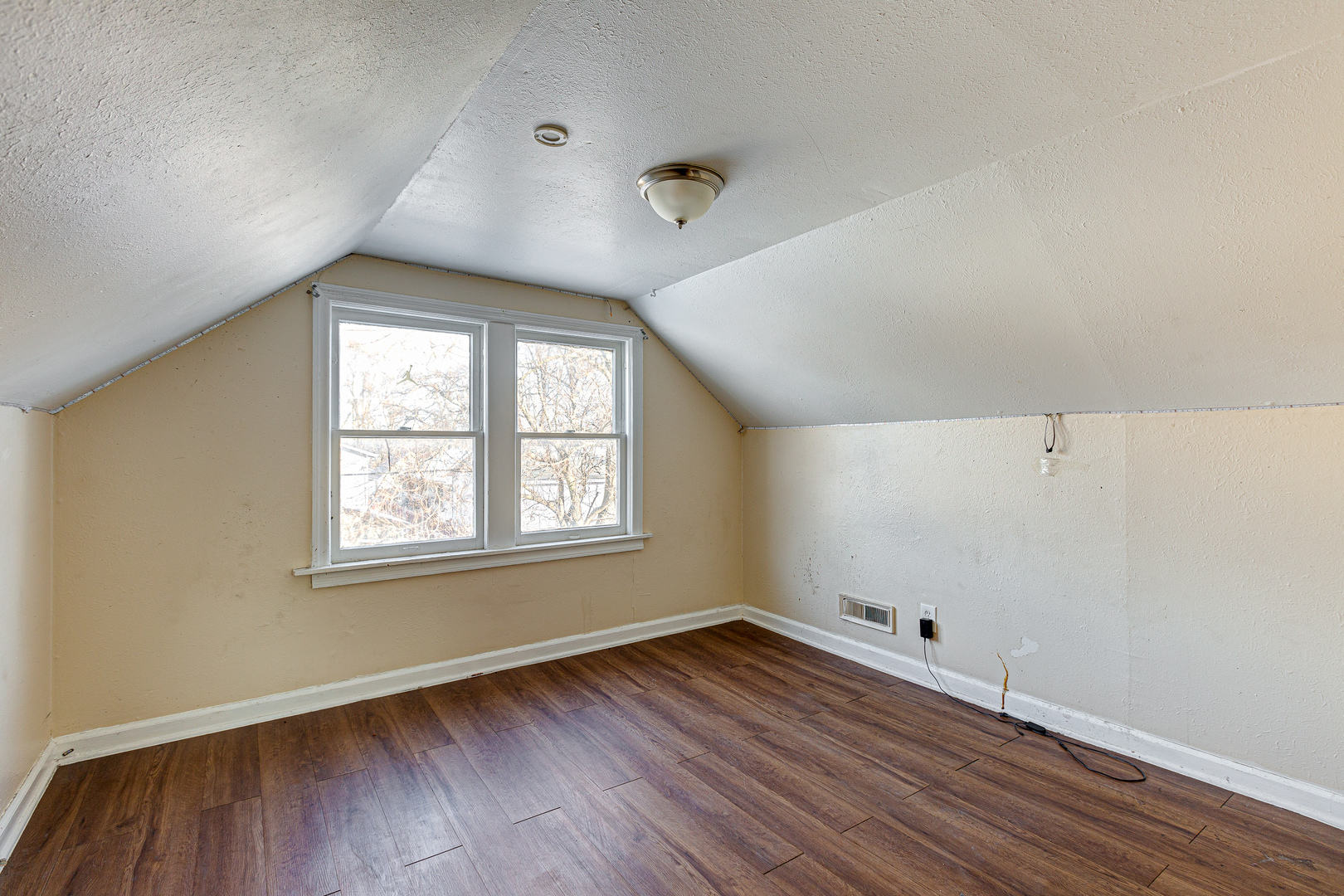 326 West Park Road Round Lake, IL 60073 - Photo 14 of 22 an empty room with wooden floor and windows