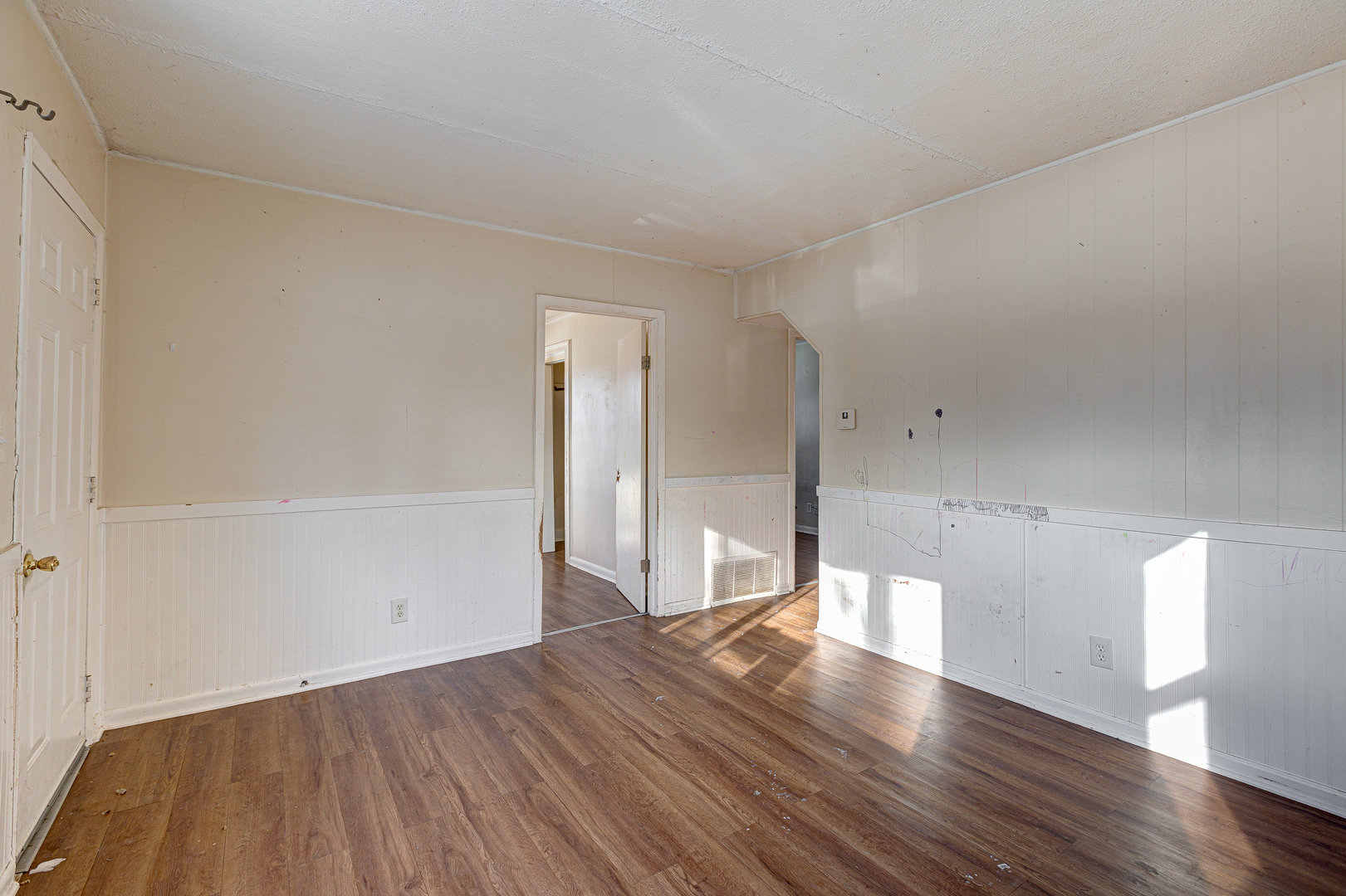 326 West Park Road Round Lake, IL 60073 - Photo 3 of 22 an empty room with wooden floor and windows
