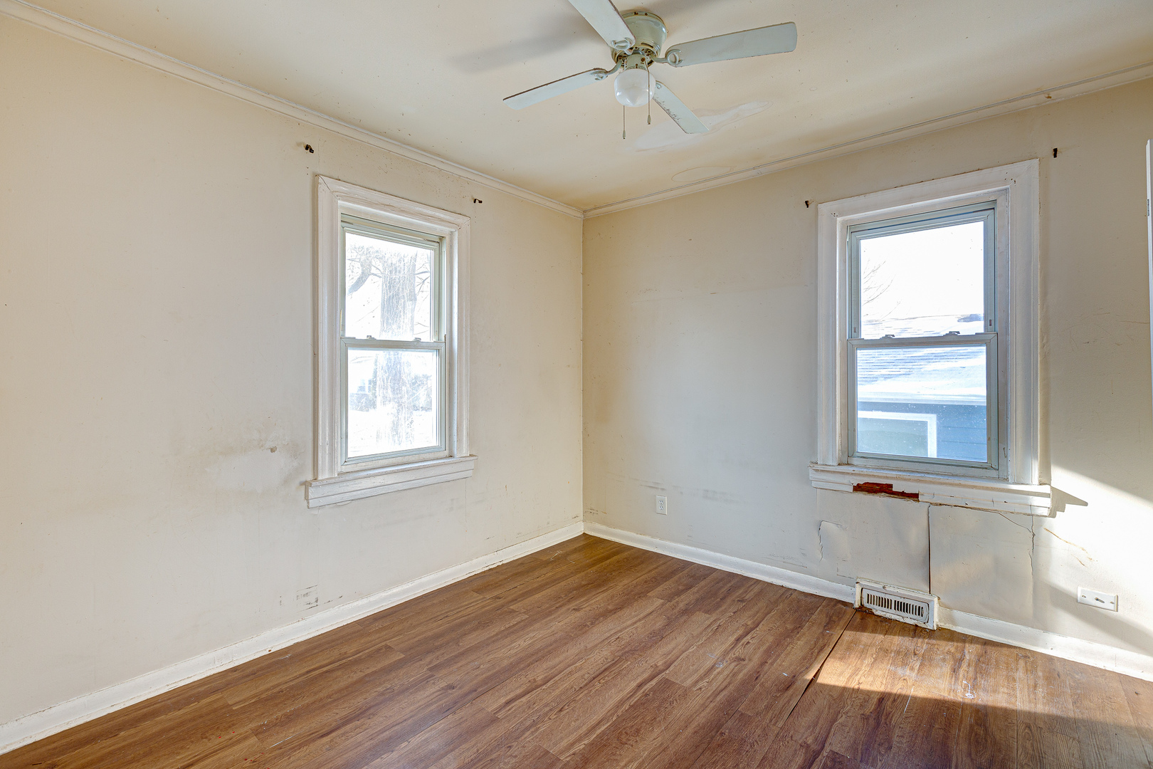 326 West Park Road Round Lake, IL 60073 - Photo 8 of 22 a view of an empty room with wooden floor and a window