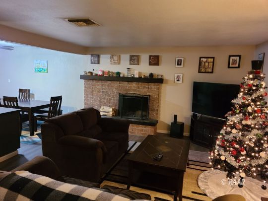 120 South Fire Opal Street Ridgecrest, CA 93555 - Photo 9 of 17 a living room with furniture and a fireplace