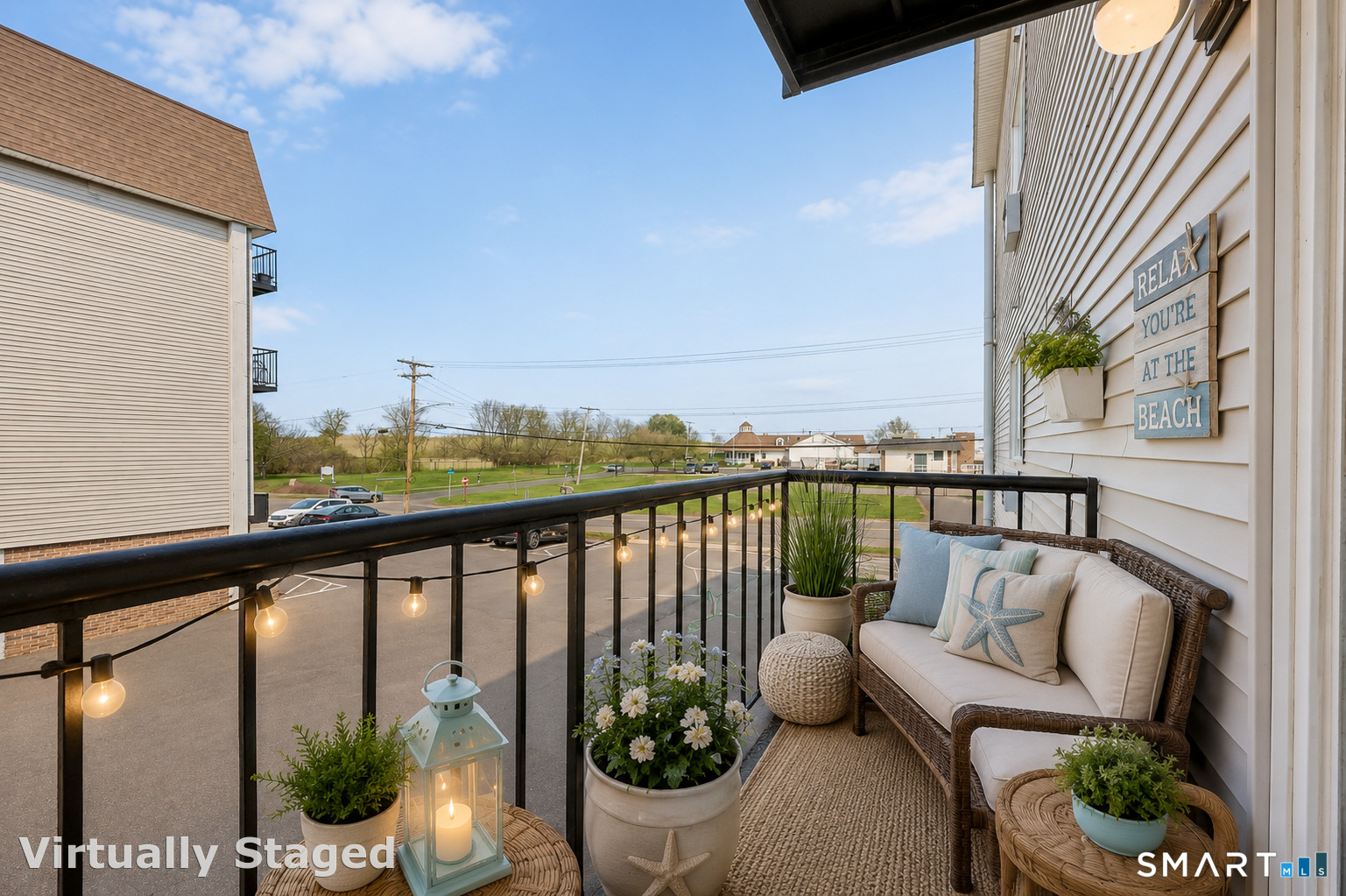 155 Short Beach Road, Unit 102 Stratford, CT 06615 - Photo 1 of 15 a view of a balcony with wooden floor and outdoor seating