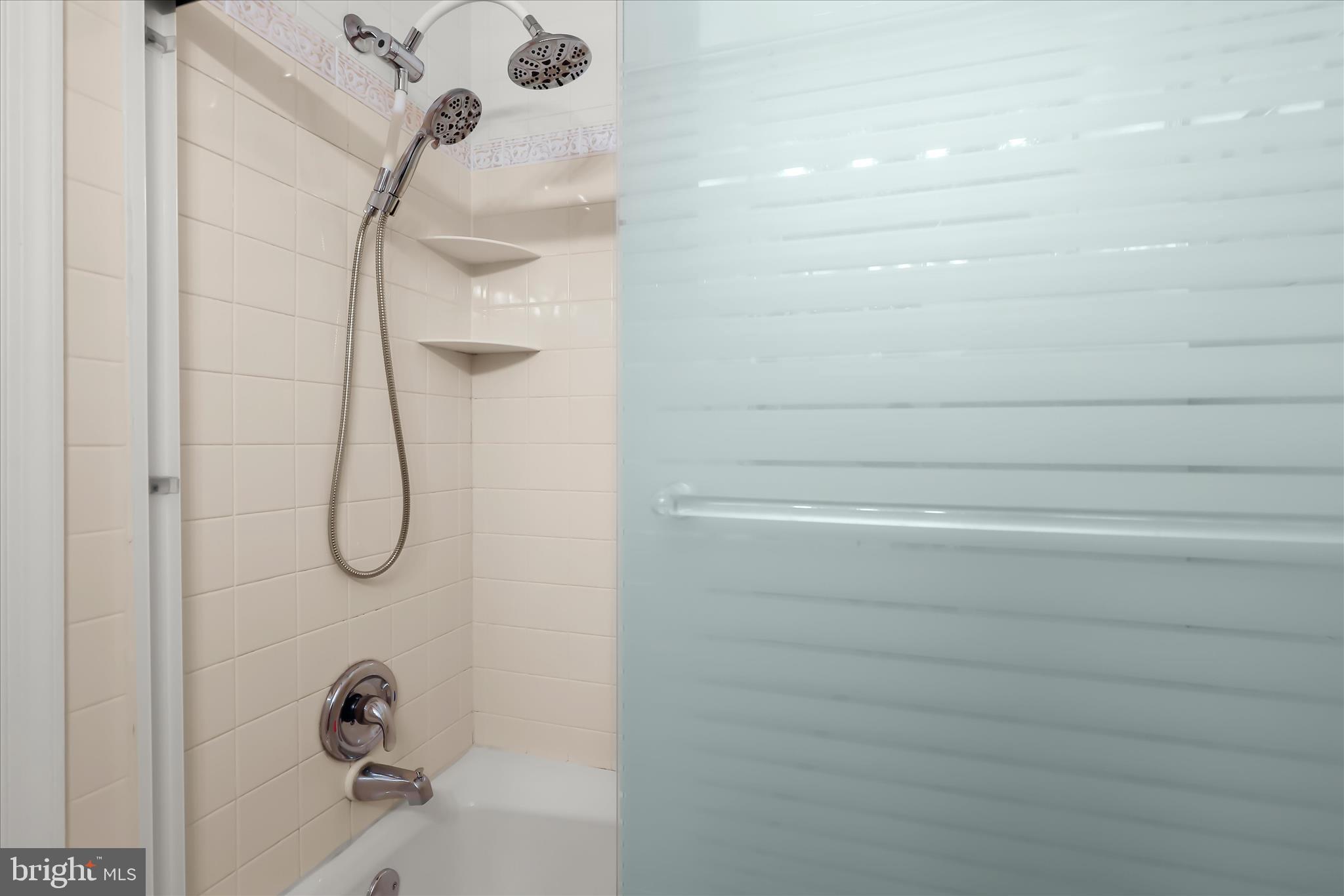 13612 Jacobs Road Mount Airy, MD 21771 - Photo 27 of 90 a bathroom with a glass shower door