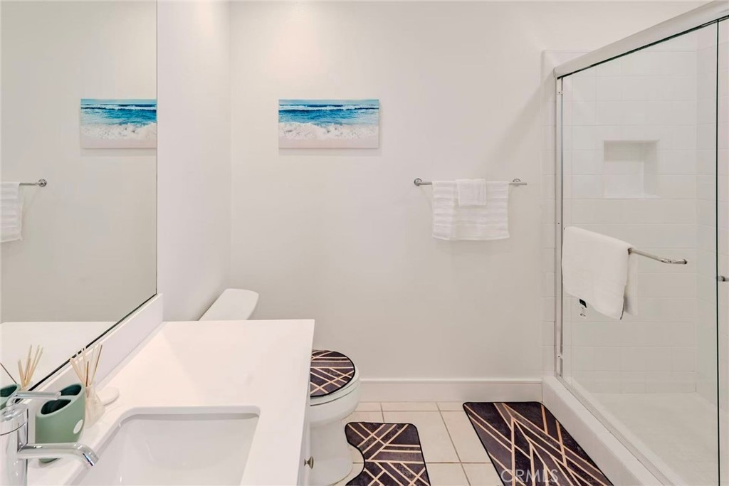 141 Dolci Irvine, CA 92602 - Photo 11 of 13 a bathroom with a bathtub and shower