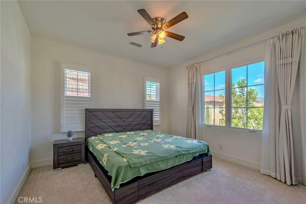 141 Dolci Irvine, CA 92602 - Photo 9 of 13 a bedroom with a bed and window
