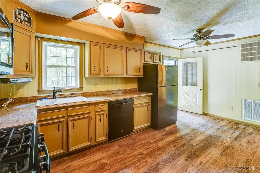 13800 Cross County Road Mineral, VA 23117 - Photo 3 of 47 a kitchen with stainless steel appliances granite countertop a sink and cabinets