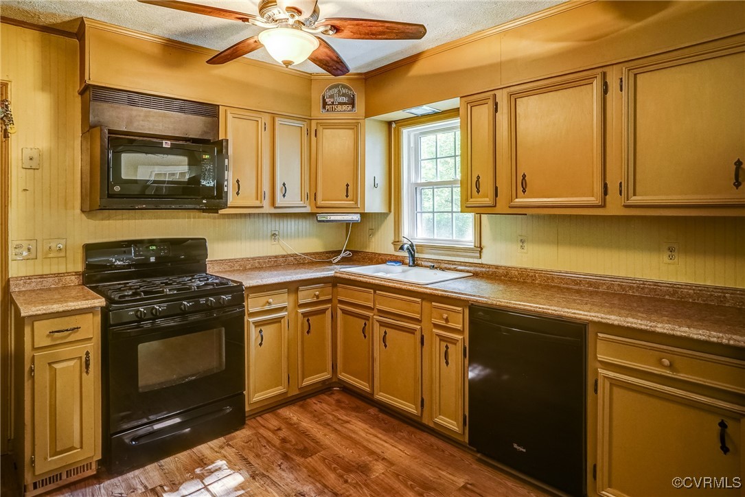 13800 Cross County Road Mineral, VA 23117 - Photo 5 of 47 a kitchen with a stove a sink and a microwave
