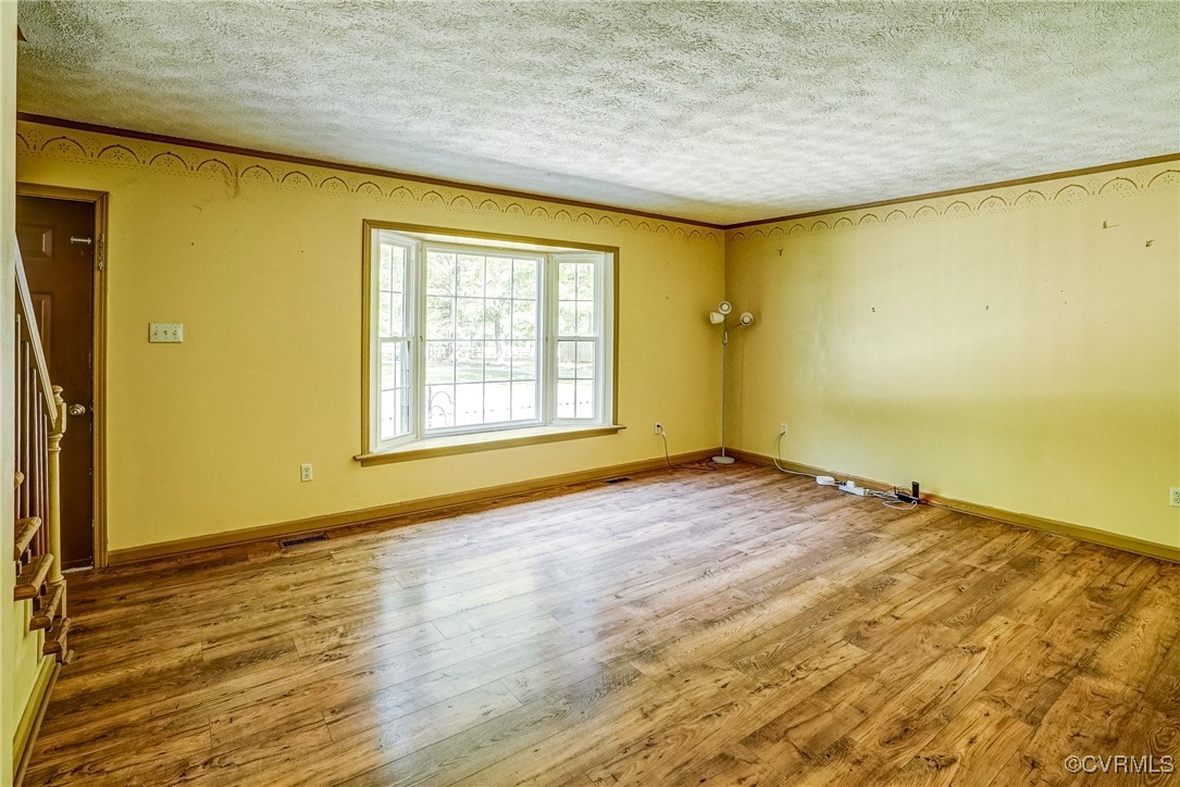 13800 Cross County Road Mineral, VA 23117 - Photo 10 of 47 a view of an empty room with wooden floor and a window