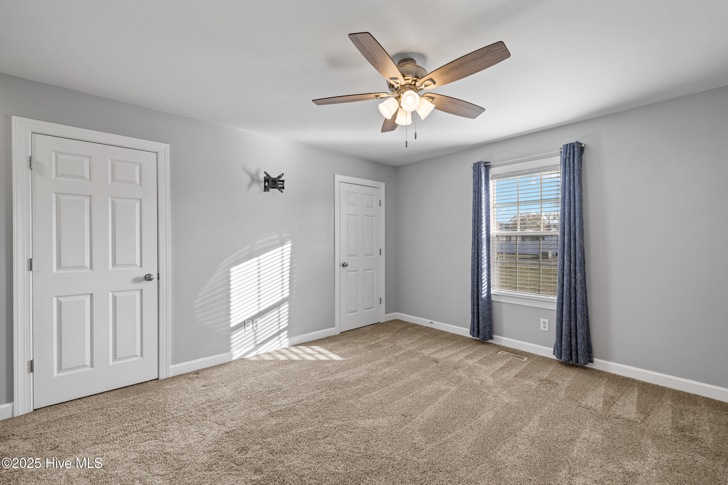105 Olive Lane Mount Olive, NC 28365 - Photo 17 of 31 Primary Bedroom with His and Hers Closets