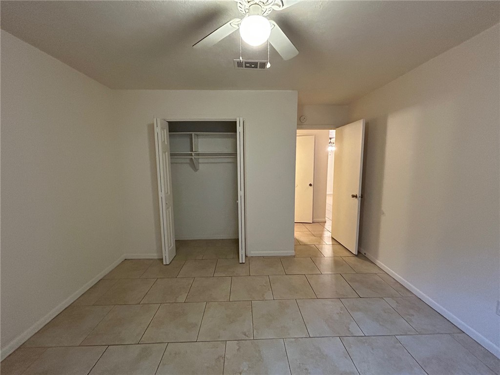 1913 Pine Tree Drive, Unit B Bryan, TX 77802 - Photo 9 of 13 a view of an empty room and window