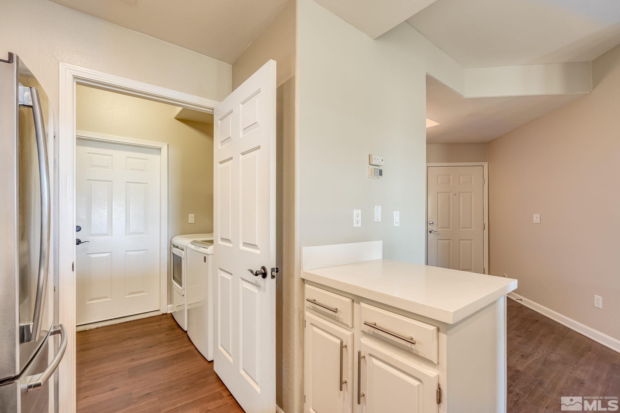 900 S Meadows, Unit 5313 Reno, NV 89521 - Photo 13 of 29 a view of a hallway with wooden floor