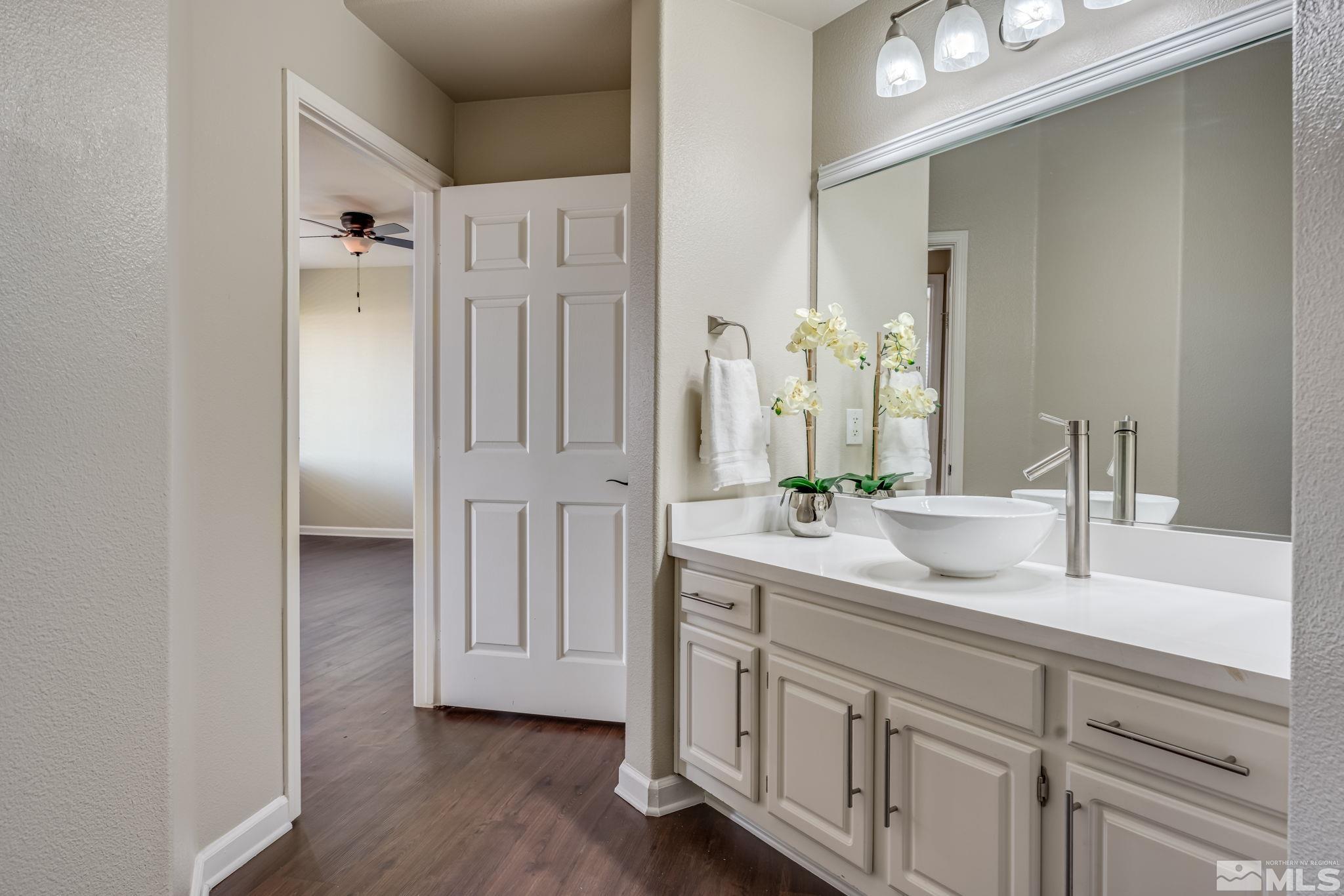 900 S Meadows, Unit 5313 Reno, NV 89521 - Photo 16 of 29 a bathroom with a double vanity sink and mirror