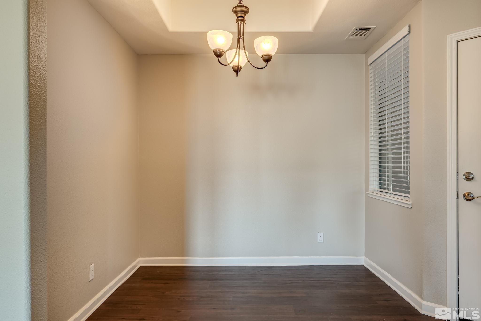900 S Meadows, Unit 5313 Reno, NV 89521 - Photo 5 of 29 a view of a room with wooden floor and windows