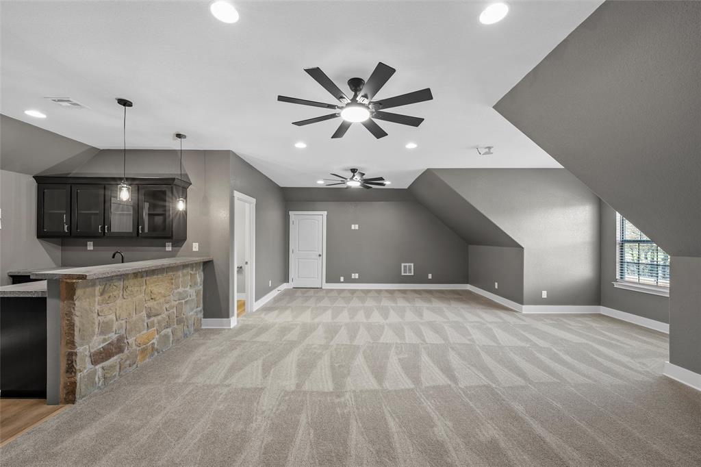 404 Casa Del Rancho Road Lorena, TX 76655 - Photo 16 of 36 a view of an empty room with a kitchen