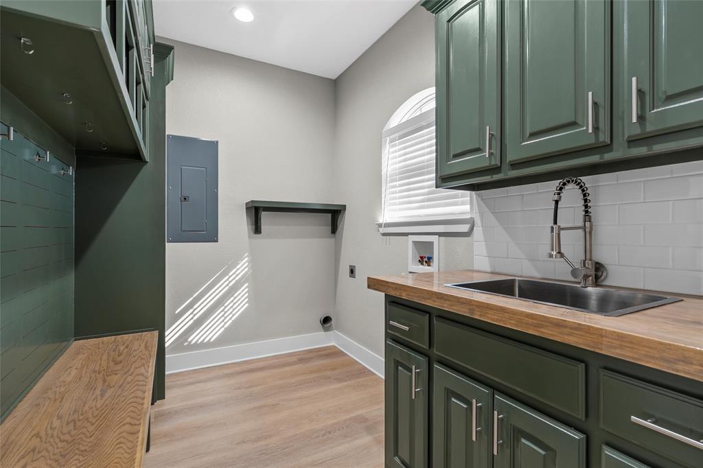 404 Casa Del Rancho Road Lorena, TX 76655 - Photo 17 of 36 a kitchen with a sink and cabinets