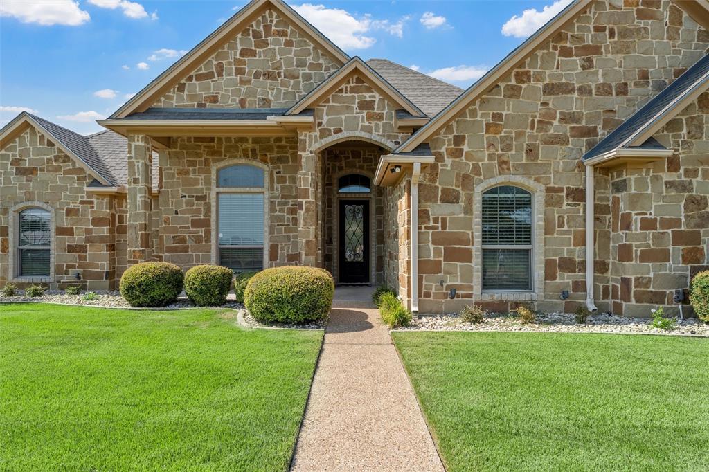 404 Casa Del Rancho Road Lorena, TX 76655 - Photo 2 of 36 a front view of a house with garden