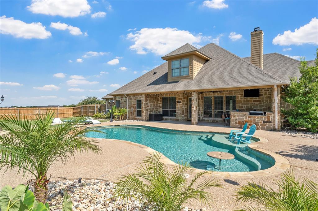 404 Casa Del Rancho Road Lorena, TX 76655 - Photo 24 of 36 a view of a house with swimming pool and porch with furniture