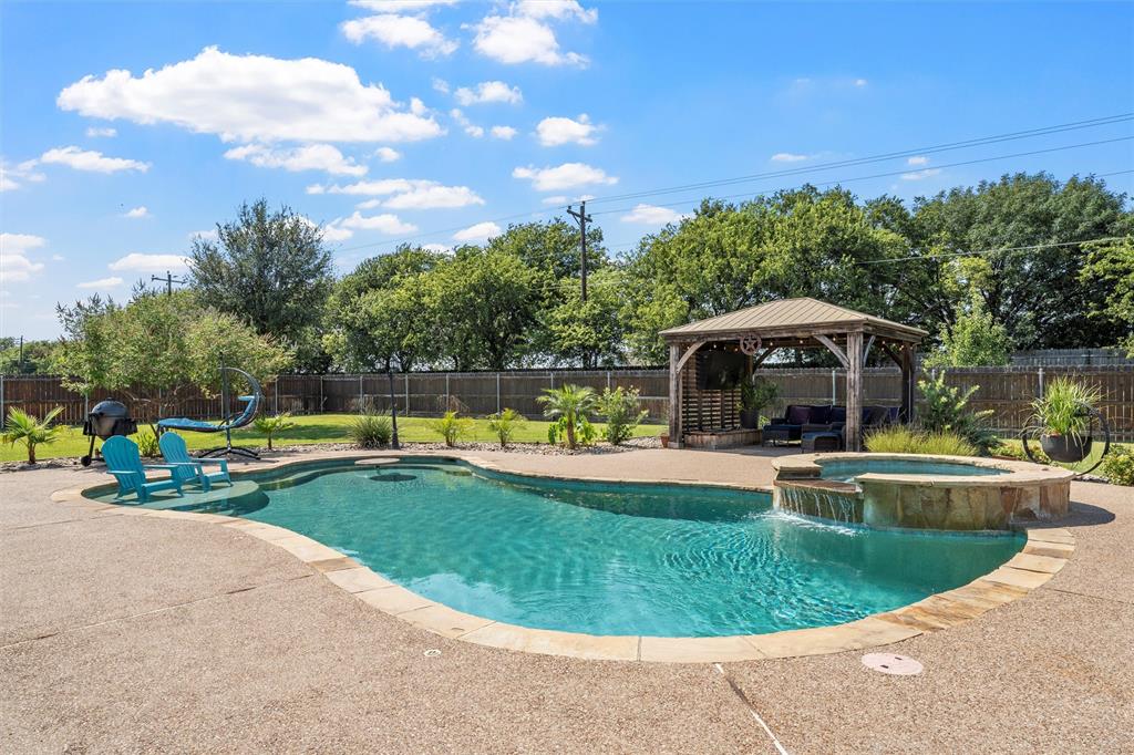 404 Casa Del Rancho Road Lorena, TX 76655 - Photo 25 of 36 a view of a swimming pool with a yard