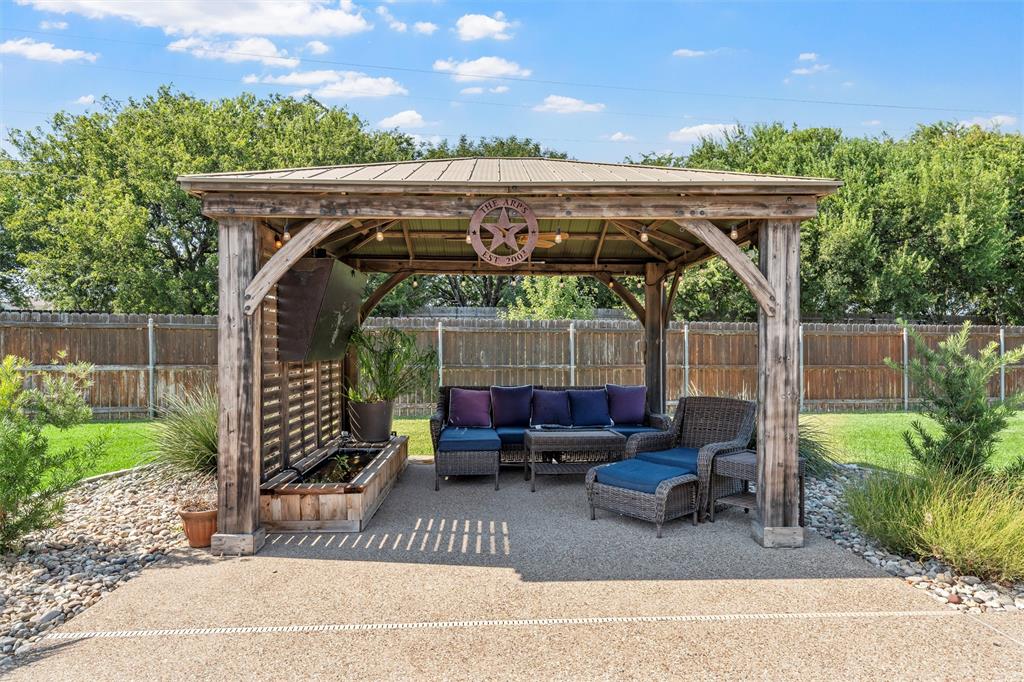 404 Casa Del Rancho Road Lorena, TX 76655 - Photo 27 of 36 a view of patio with furniture and a garden