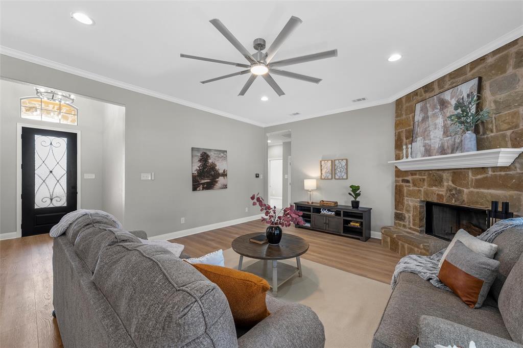 404 Casa Del Rancho Road Lorena, TX 76655 - Photo 3 of 36 a living room with furniture and a fireplace
