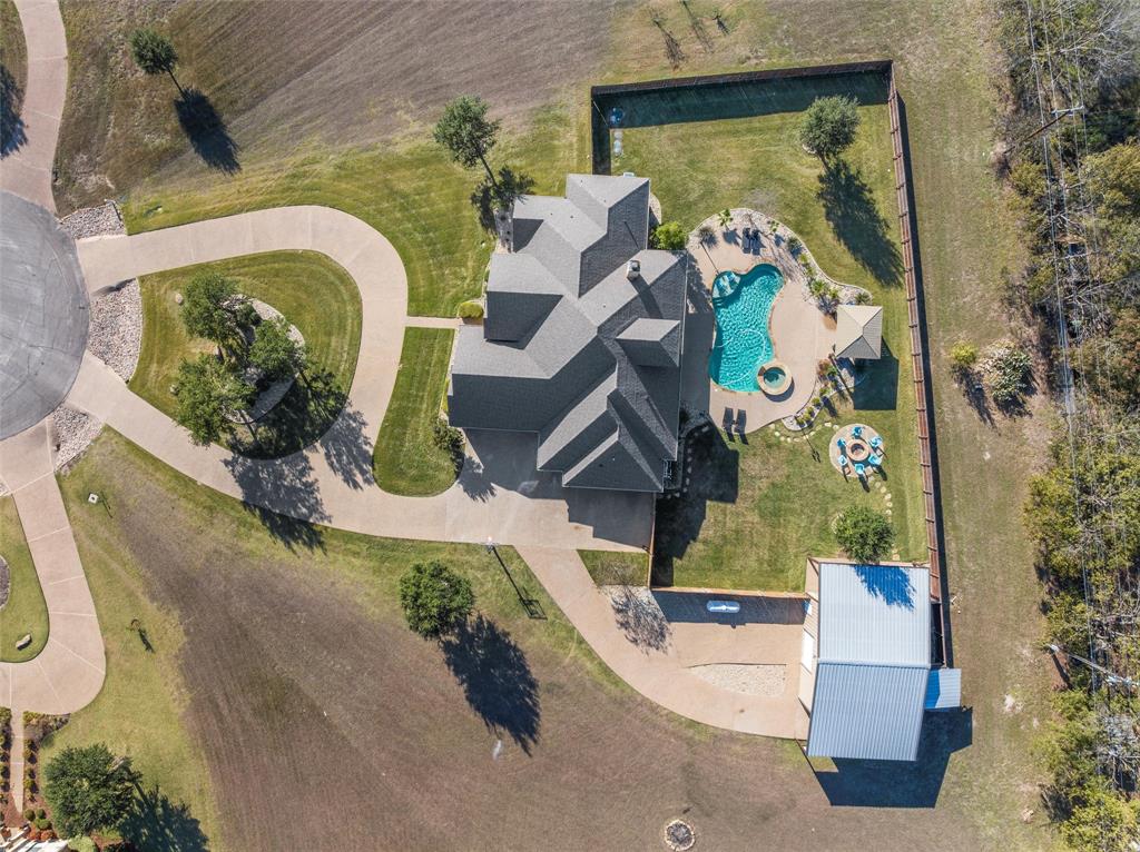 404 Casa Del Rancho Road Lorena, TX 76655 - Photo 34 of 36 an aerial view of a house with a garden