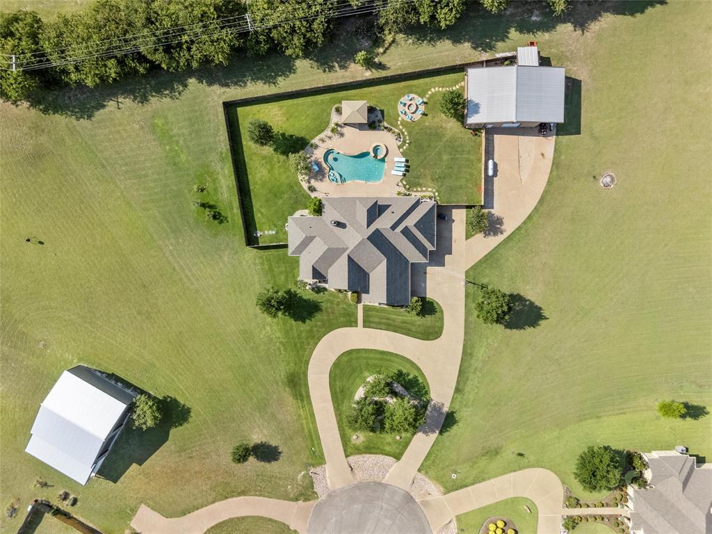 404 Casa Del Rancho Road Lorena, TX 76655 - Photo 35 of 36 an aerial view of a house with swimming pool and outdoor space