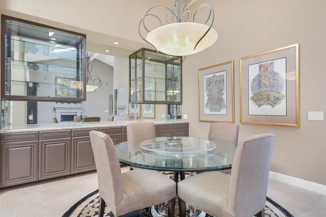 a dining room with furniture and window