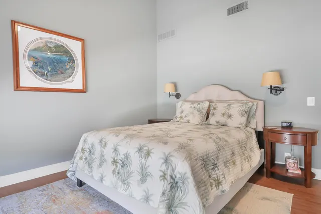 a bedroom with a bed and night stand