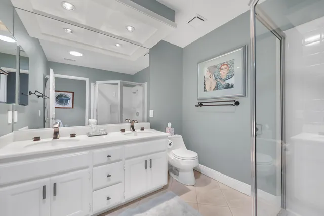 a room with a toilet a sink and mirror