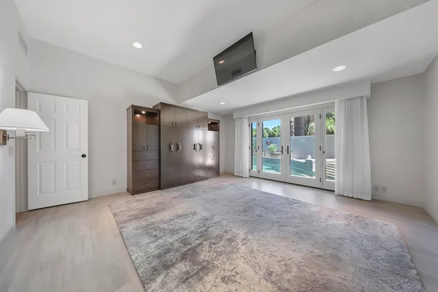 a large kitchen with a sink and dishwasher stove top oven
