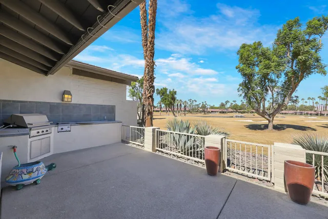 a view of a house with a small yard