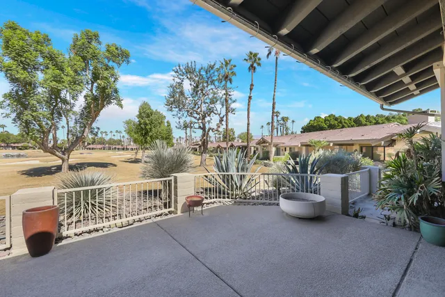a view of a house with backyard and porch