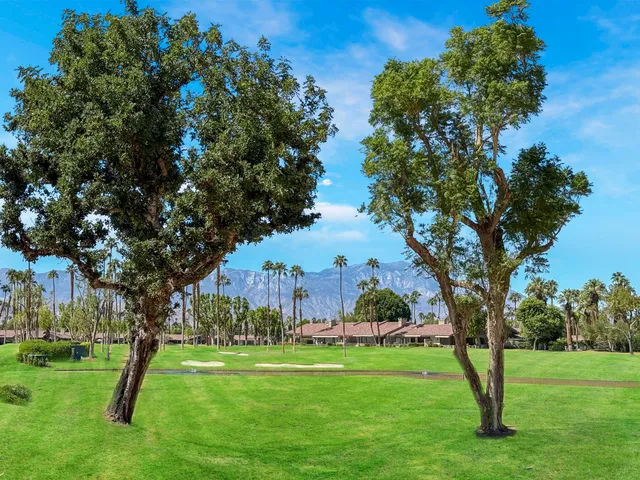 a front view of a house with outdoor seating