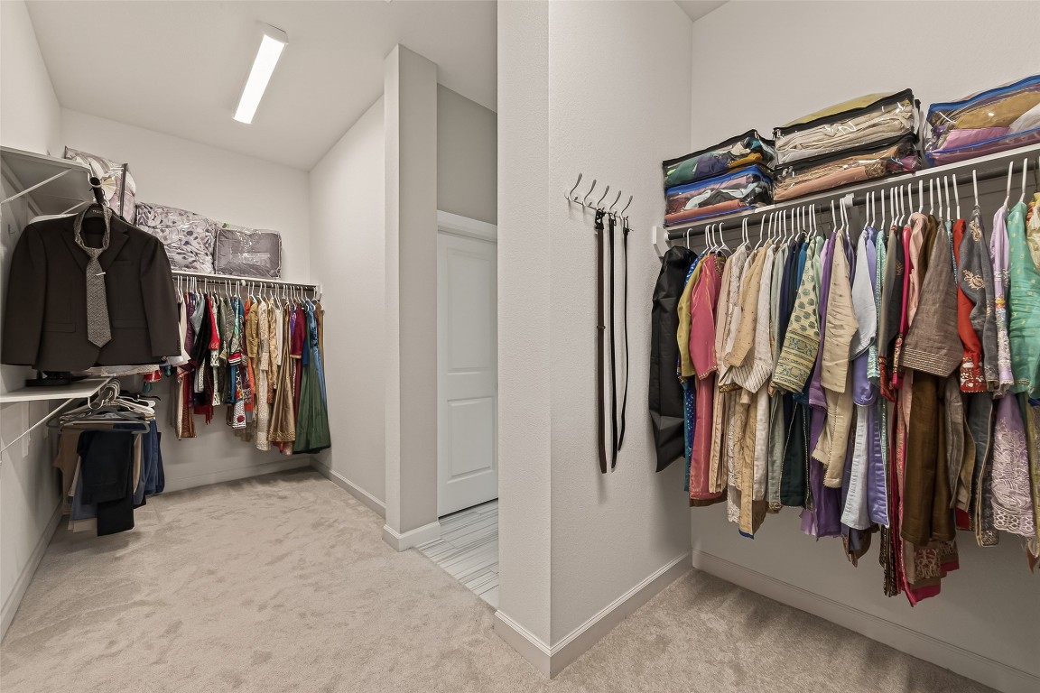 2706 Ripe Amber Cup Court Richmond, TX 77406 - Photo 43 of 50 a view of walk in closet with clothes and shoes