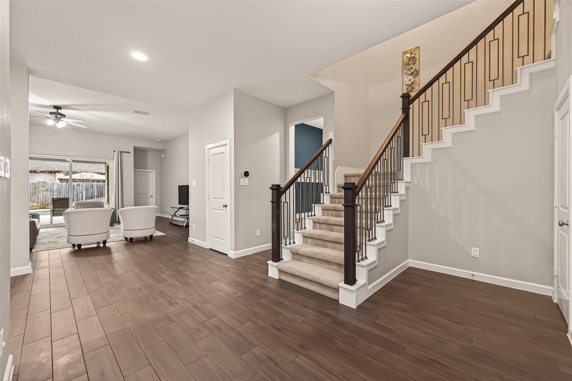 2706 Ripe Amber Cup Court Richmond, TX 77406 - Photo 5 of 50 a view of an entryway with wooden floor and windows