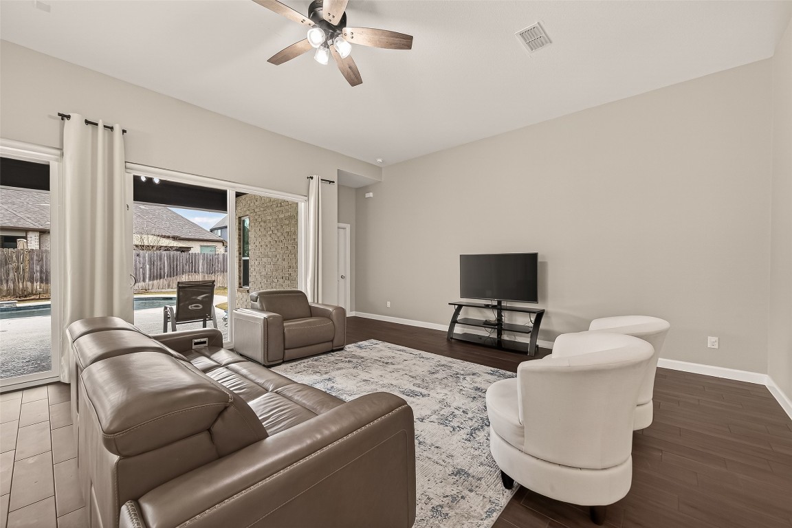 2706 Ripe Amber Cup Court Richmond, TX 77406 - Photo 7 of 50 a living room with furniture and a flat screen tv
