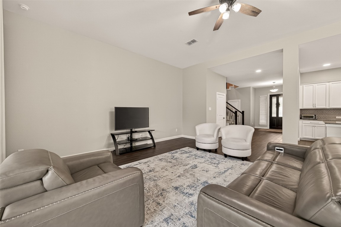 2706 Ripe Amber Cup Court Richmond, TX 77406 - Photo 8 of 50 a living room with furniture and a flat screen tv