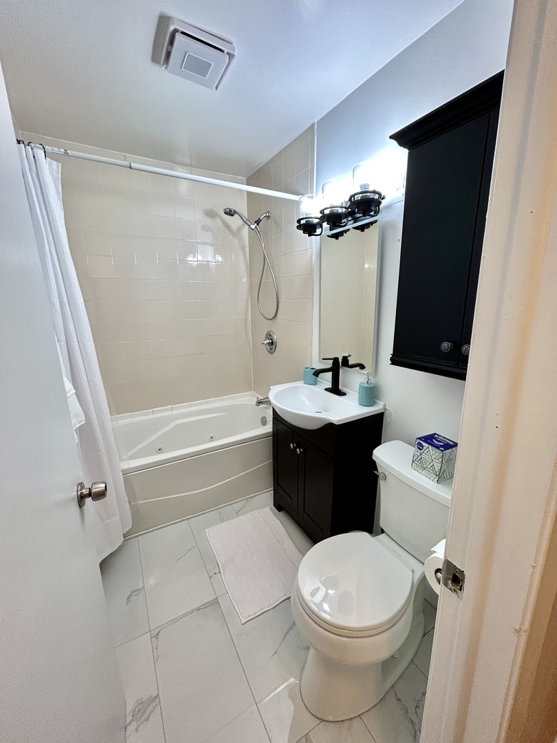 905 Rockland Road Lake Bluff, IL 60044 - Photo 15 of 16 a bathroom with a sink a toilet and a shower