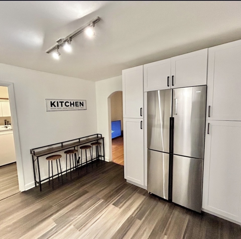 905 Rockland Road Lake Bluff, IL 60044 - Photo 3 of 16 a kitchen with stainless steel appliances a refrigerator and wooden floor