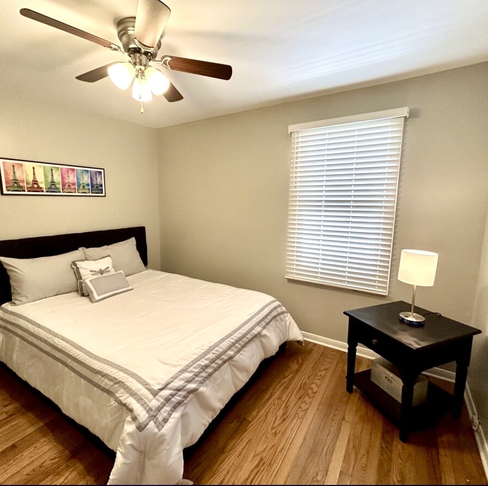 905 Rockland Road Lake Bluff, IL 60044 - Photo 8 of 16 a bedroom with a bed and a window