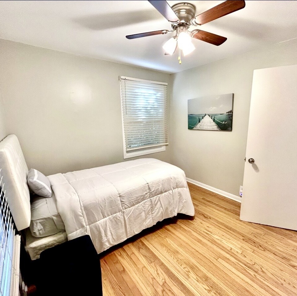 905 Rockland Road Lake Bluff, IL 60044 - Photo 9 of 16 a bedroom with a bed and a window