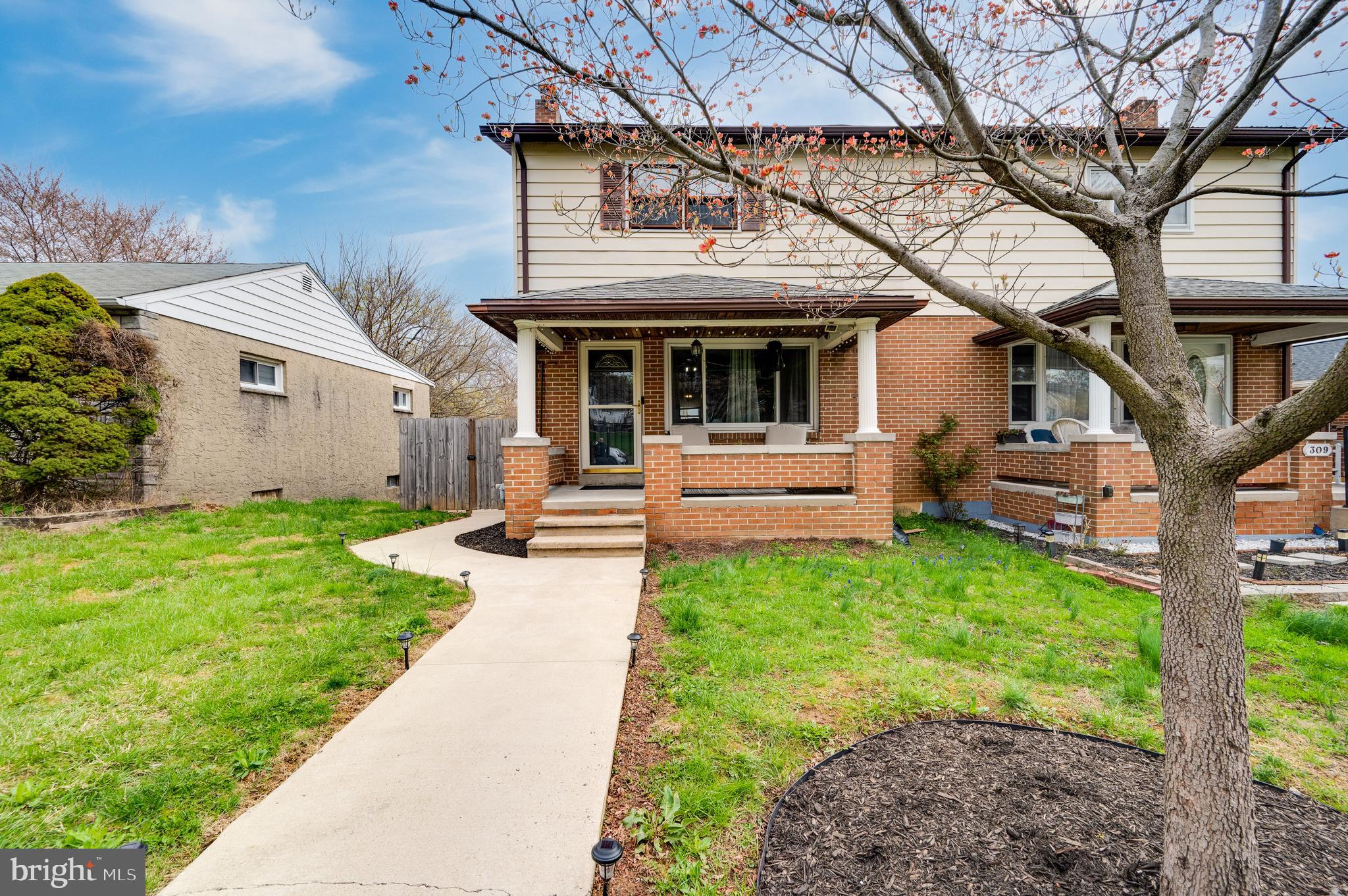 311 Funston Avenue Reading, PA 19607 - Photo 2 of 56 a front view of a house with garden
