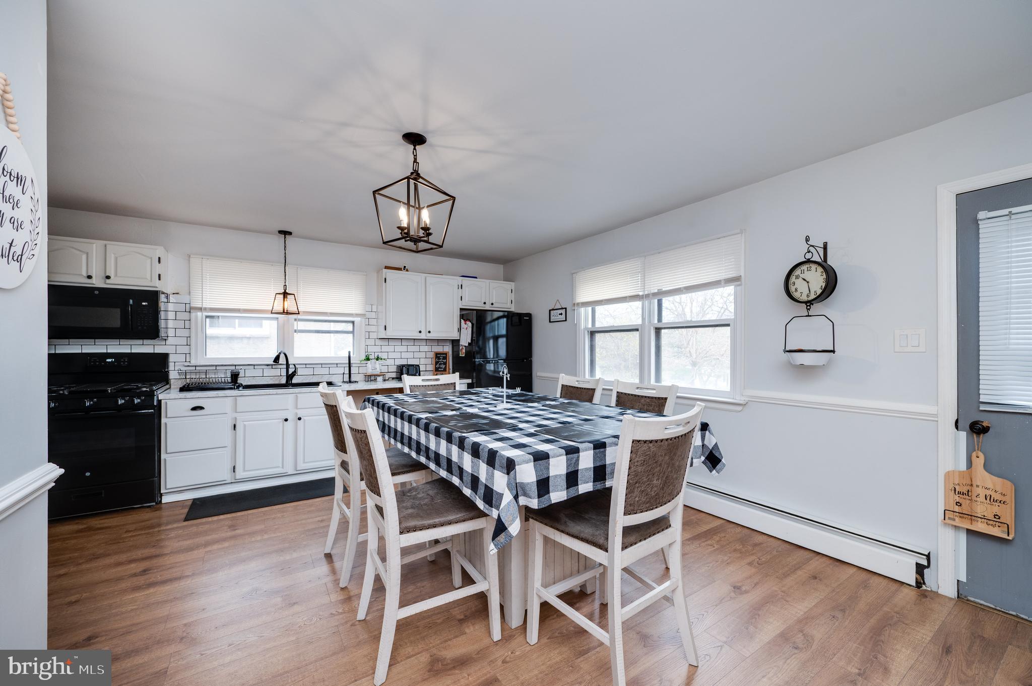 311 Funston Avenue Reading, PA 19607 - Photo 21 of 56 a kitchen with granite countertop stainless steel appliances a dining table and chairs