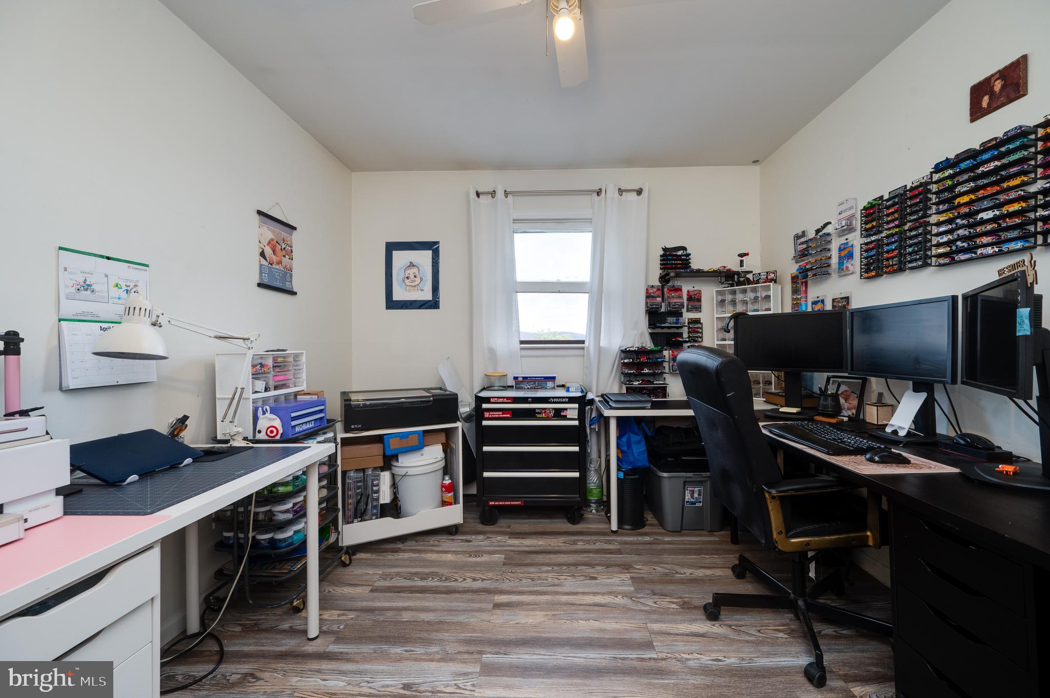 311 Funston Avenue Reading, PA 19607 - Photo 32 of 56 a view of a workspace with furniture and a window