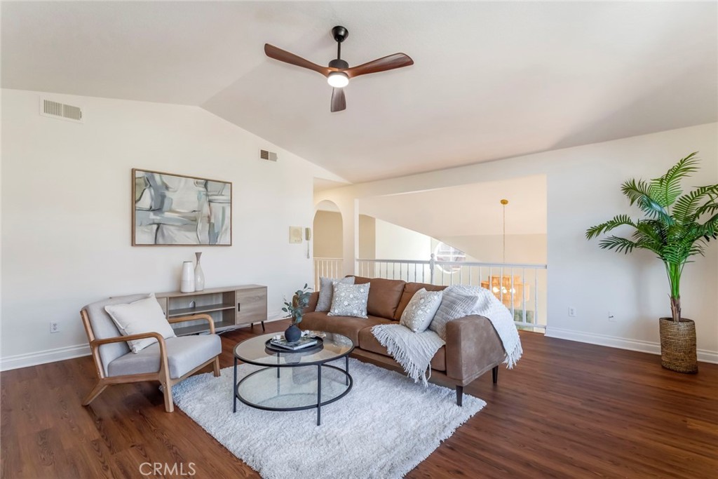 29033 Shadow Valley Lane Saugus, CA 91390 - Photo 40 of 73 a living room with furniture potted plant and a ceiling fan