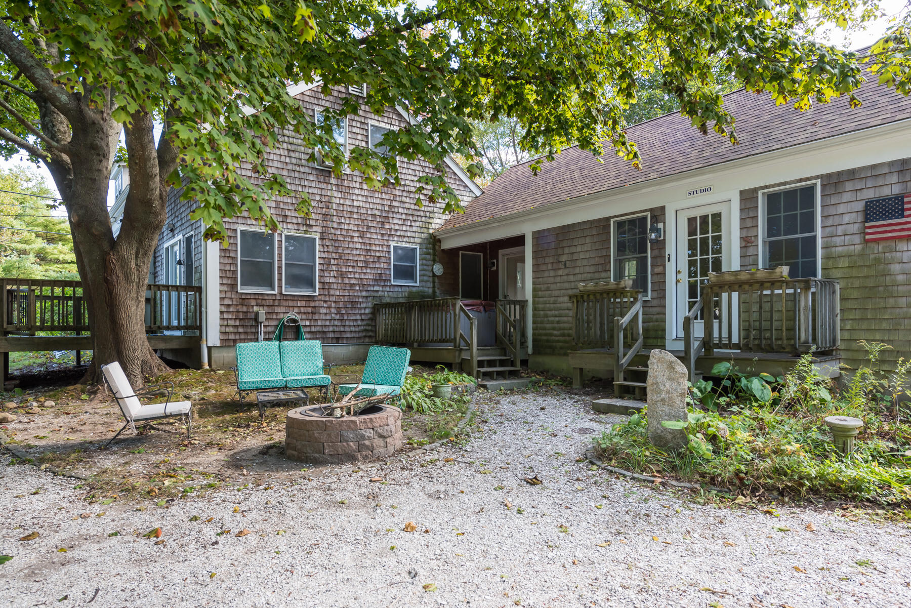 39 Route 130 Sandwich, MA 02644 - Photo 16 of 29 a view of a house with backyard sitting area and garden