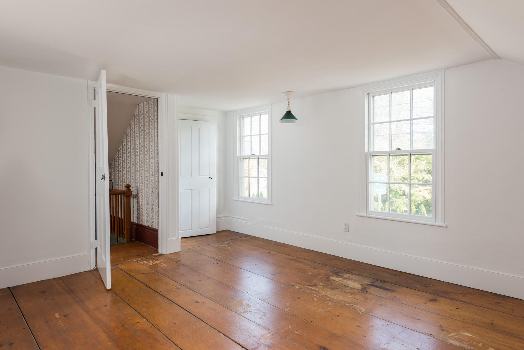39 Route 130 Sandwich, MA 02644 - Photo 9 of 29 a view of an empty room with wooden floor and a window