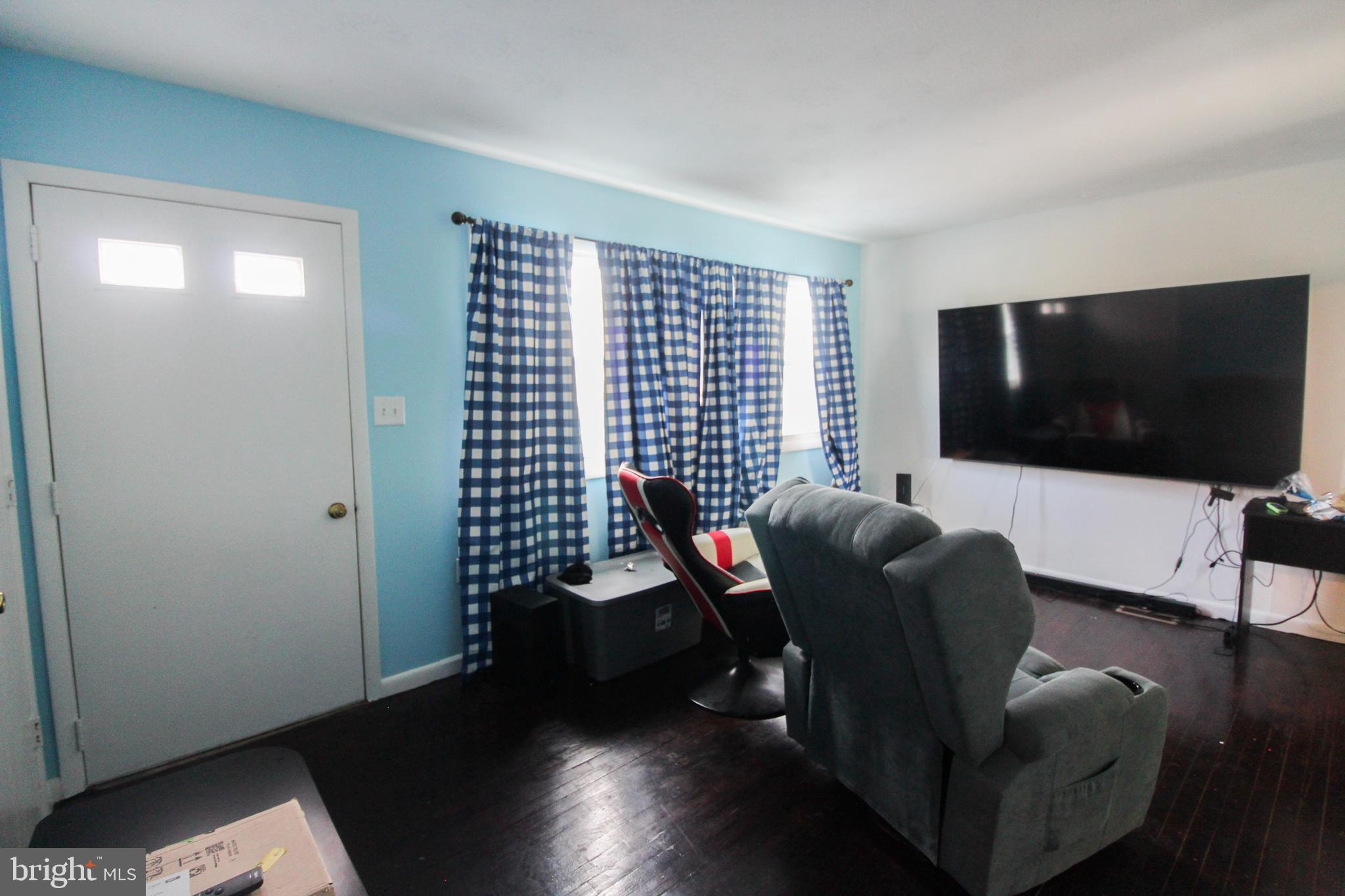 2212 Swartz Road Woodstock, VA 22664 - Photo 13 of 21 a living room with furniture and a flat screen tv