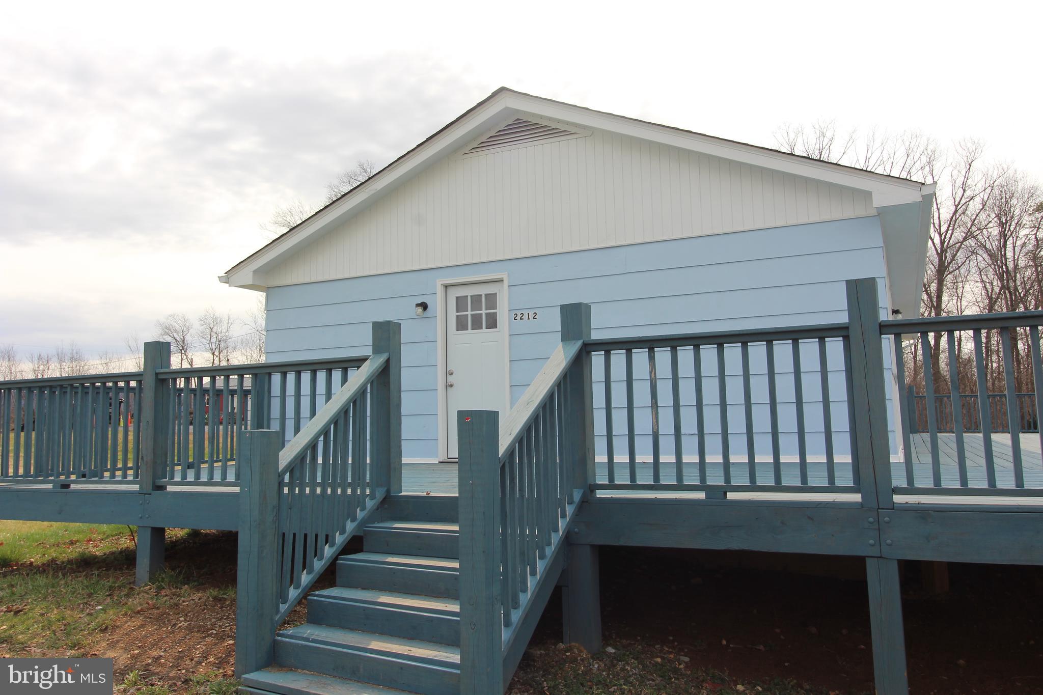 2212 Swartz Road Woodstock, VA 22664 - Photo 5 of 21 a view of a house with wooden deck